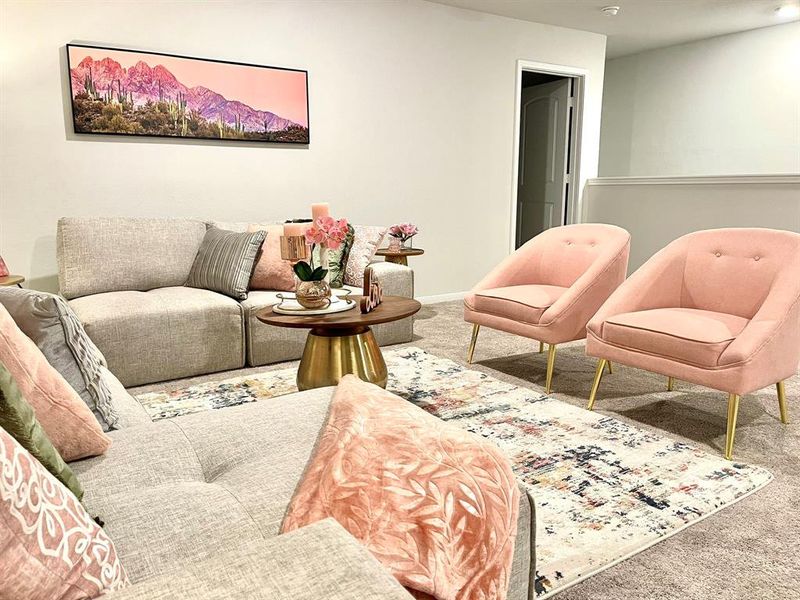 Living room with baseboards and carpet floors Living room with baseboards and carpet floors