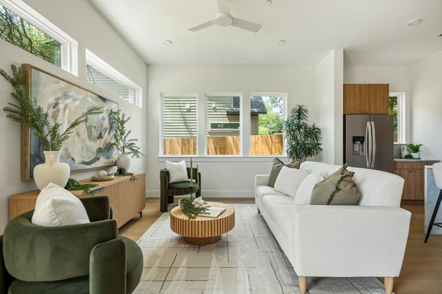 Discover a naturally illuminated living space, boasting high ceilings and sleek hardwood flooring. Discover a naturally illuminated living space, boasting high ceilings and sleek hardwood flooring.