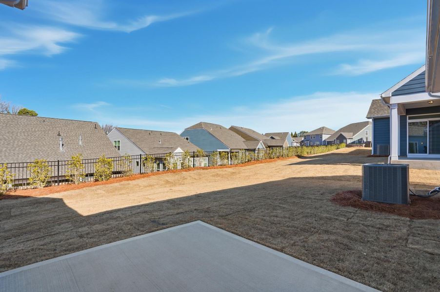 Exterior details and patio area of a home in Villas at Prestwick, Mooresville (Image 28).