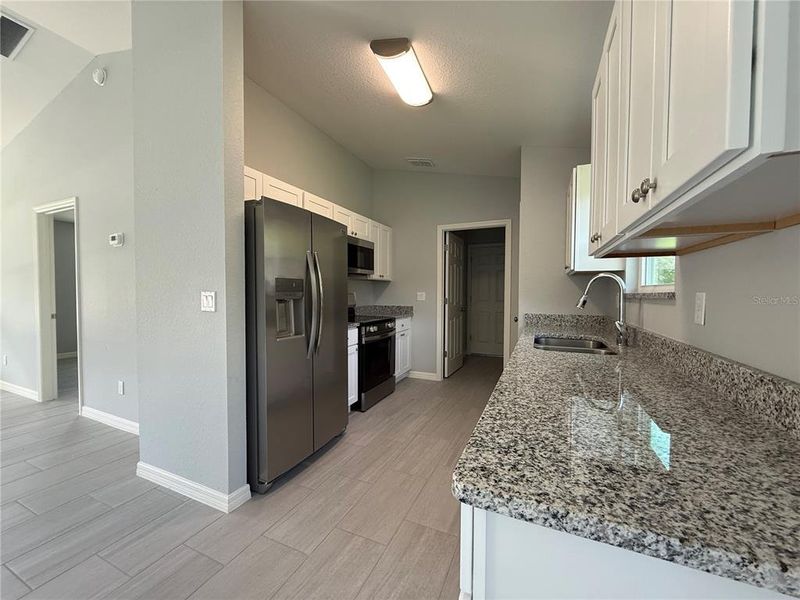 Furnished interior view inside a new home in , Dunnellon (Image 7).