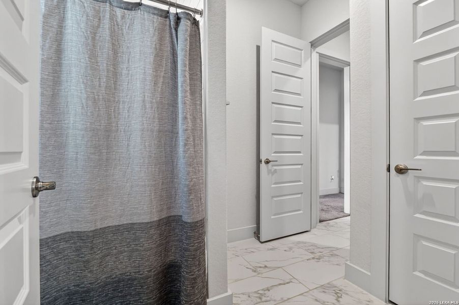 Furnished interior view inside a new home in Pradera Ridge, Floresville (Image 35).