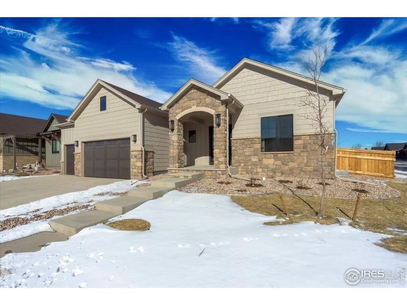 Front exterior of a new home in , Windsor, CO, highlighting curb appeal (Image 1). Front exterior of a new home in , Windsor, CO, highlighting curb appeal (Image 1).