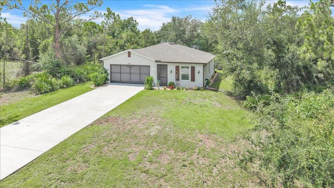 Front exterior of a new home in , Punta Gorda, FL, highlighting curb appeal (Image 25). Front exterior of a new home in , Punta Gorda, FL, highlighting curb appeal (Image 25).