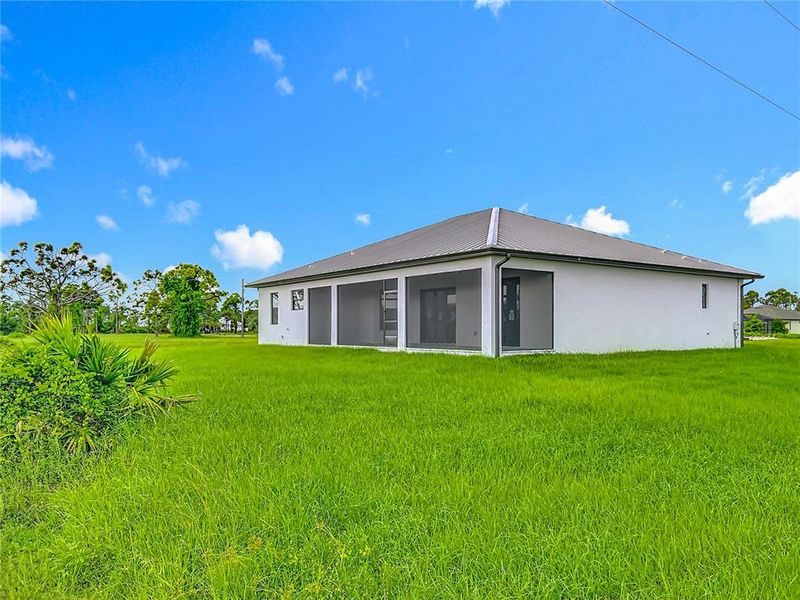 Front exterior of a new home in , Placida, FL, highlighting curb appeal (Image 25). Front exterior of a new home in , Placida, FL, highlighting curb appeal (Image 25).