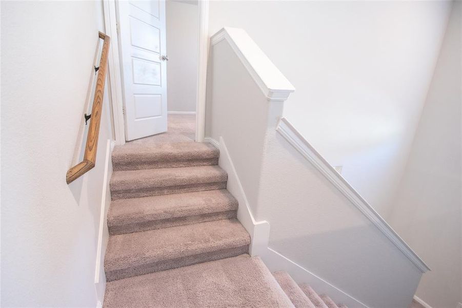 Up the stairs to the bedroom 4 and ensuite bath Up the stairs to the bedroom 4 and ensuite bath