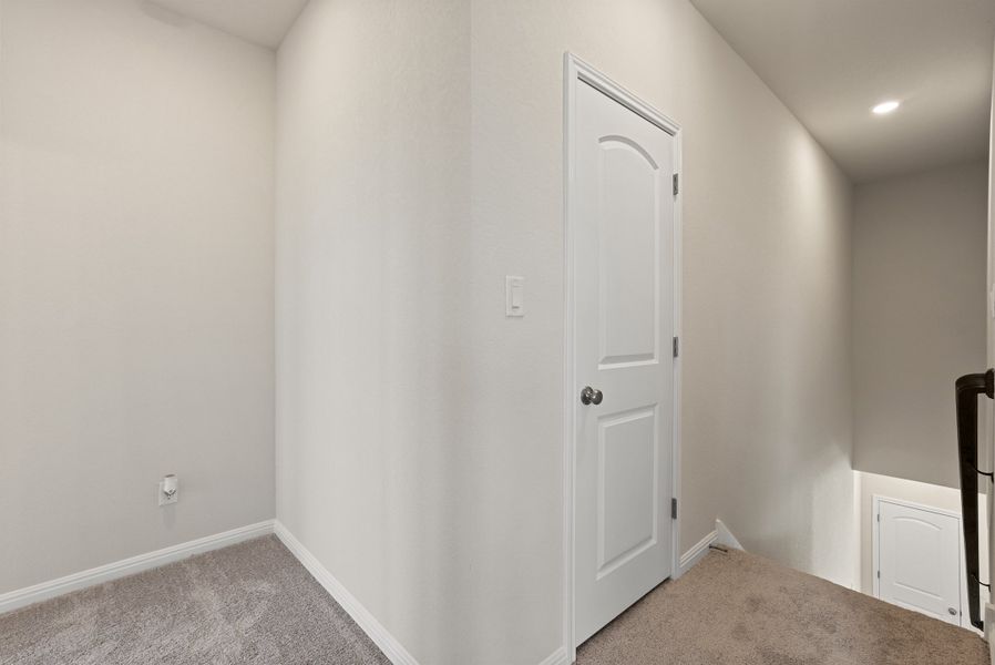 Representative unfurnished interior of a home built from the Somerville by Ashton Woods in Willow Springs, Buda (Image 38).