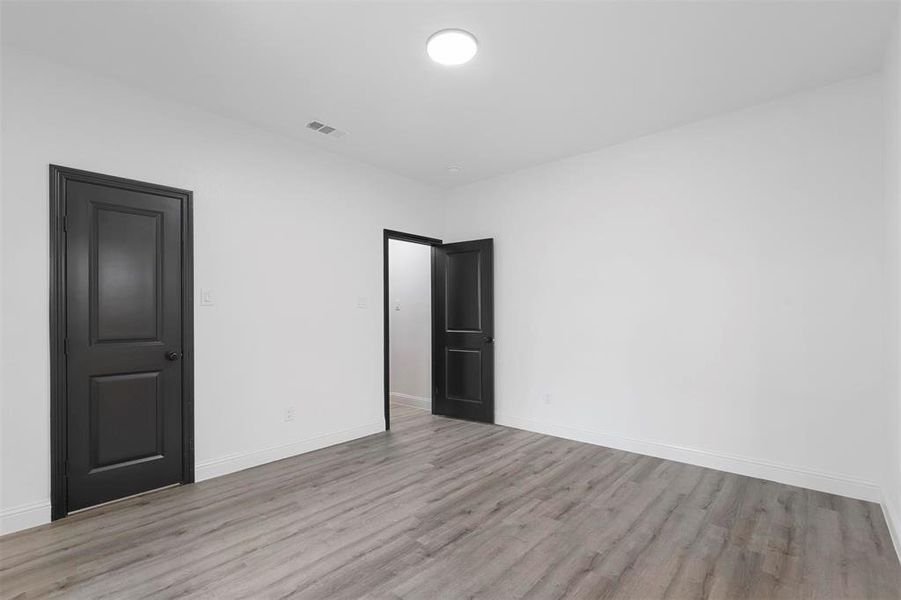 Empty room featuring light hardwood / wood-style flooring