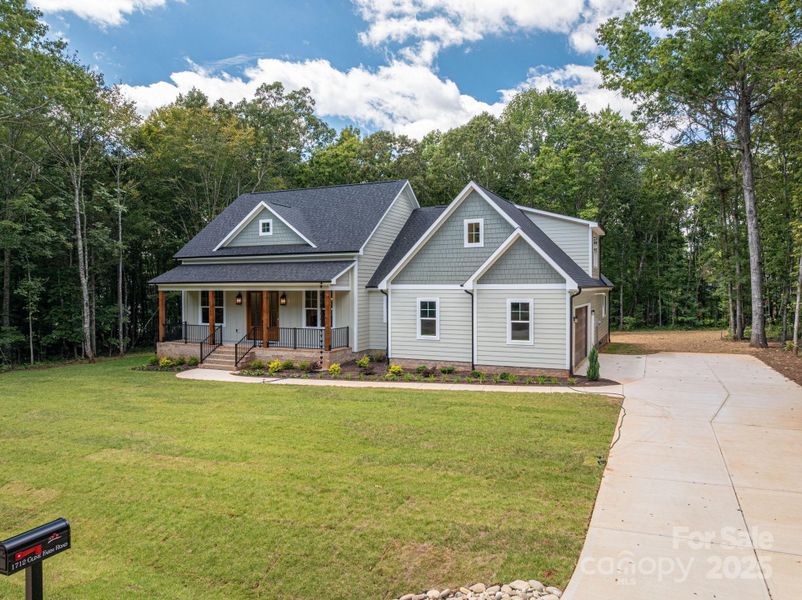 Front exterior of a new home in , Lincolnton, NC, highlighting curb appeal (Image 1).