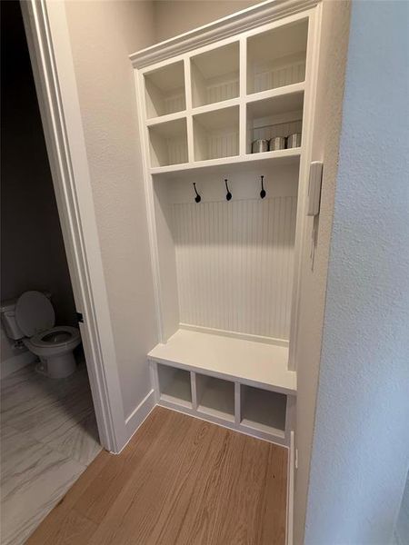 Mudroom with light wood-style floors and baseboards Mudroom with light wood-style floors and baseboards