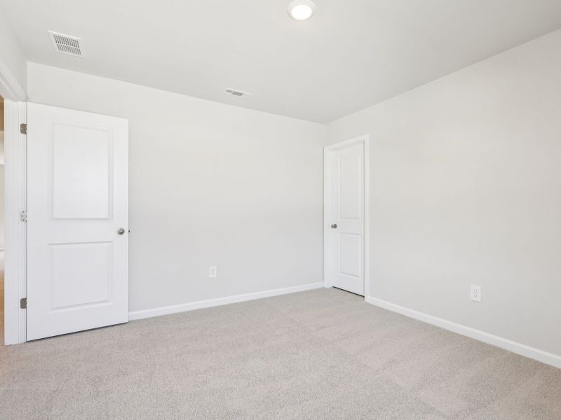 Spacious, unfurnished interior of a new home in Moss Farms, Lula (Image 22).
