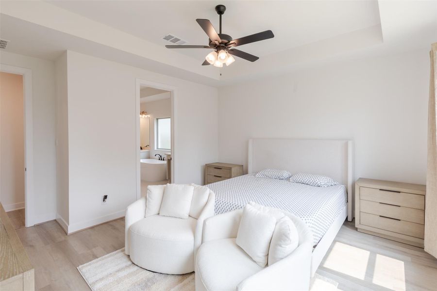 An ensuite bathroom is visible, enhancing convenience and privacy.