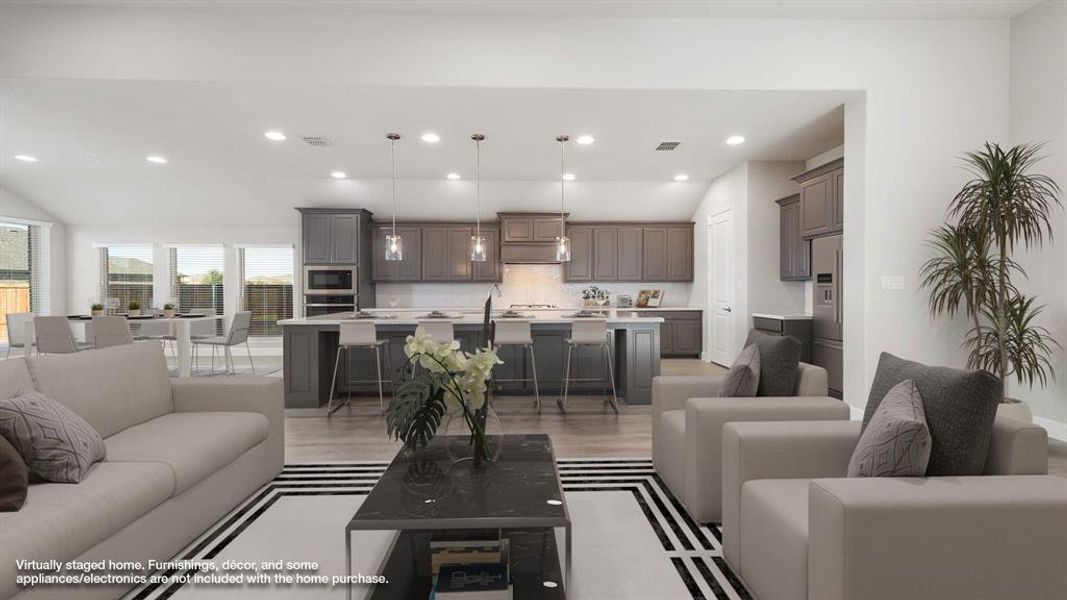 Living room featuring vaulted ceiling