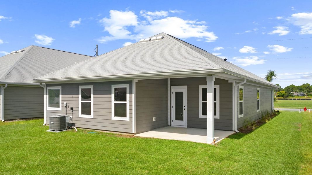 Exterior details and patio area of a home in Caballeros Estates At Hombre, Panama City Beach (Image 3).