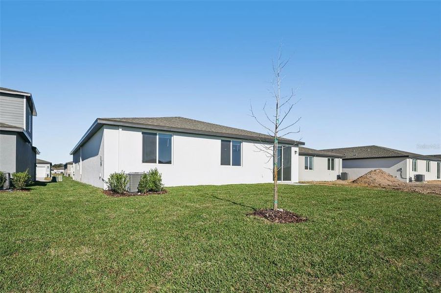 Exterior details and patio area of a home in The Grove at Stuart Crossing - Classic Series, Bartow (Image 4).