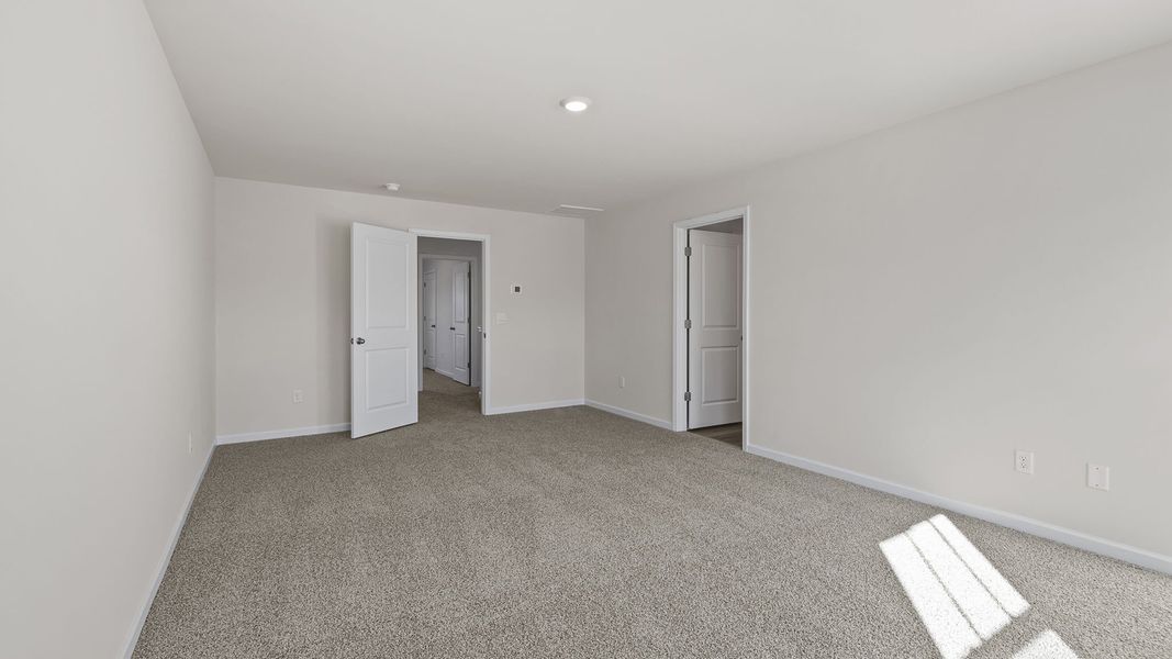 Spacious, unfurnished interior of a new home in Bentley Park, Greenwood (Image 30).