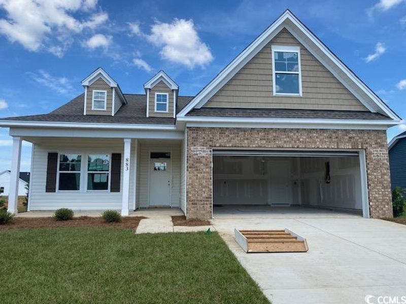 Front exterior of a new home in Oak Hollow, Longs, SC, highlighting curb appeal (Image 1).