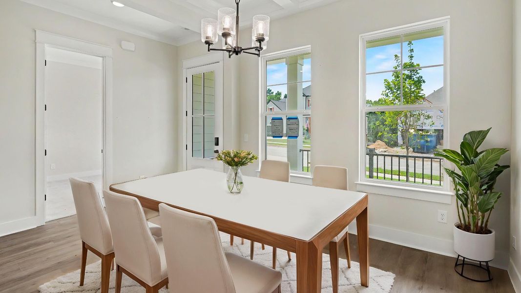 Dining area with windows and hard surface flooring Dining area with windows and hard surface flooring