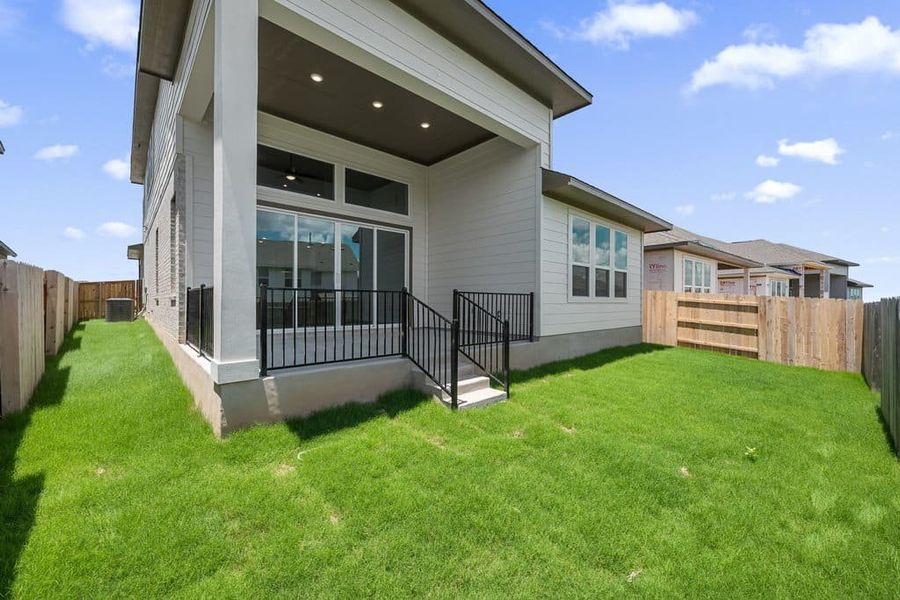 Exterior details and patio area of a home in Lariat, Liberty Hill (Image 24). Exterior details and patio area of a home in Lariat, Liberty Hill (Image 24).