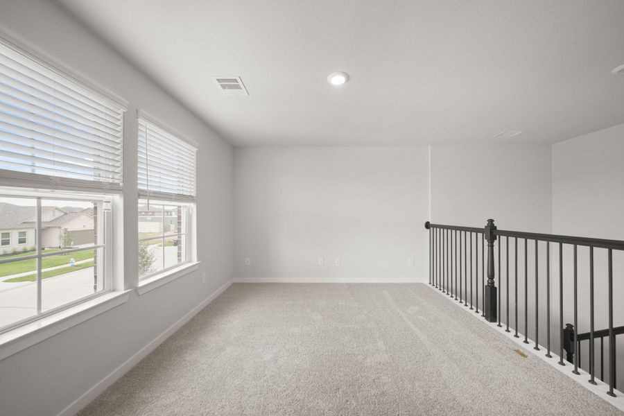 Spacious, unfurnished interior of a new home in Sunterra, Katy (Image 25).