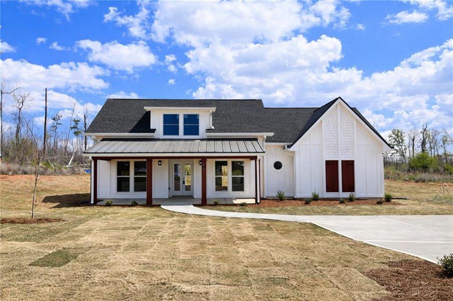 Front exterior of a new home in , Griffin, GA, highlighting curb appeal (Image 15).