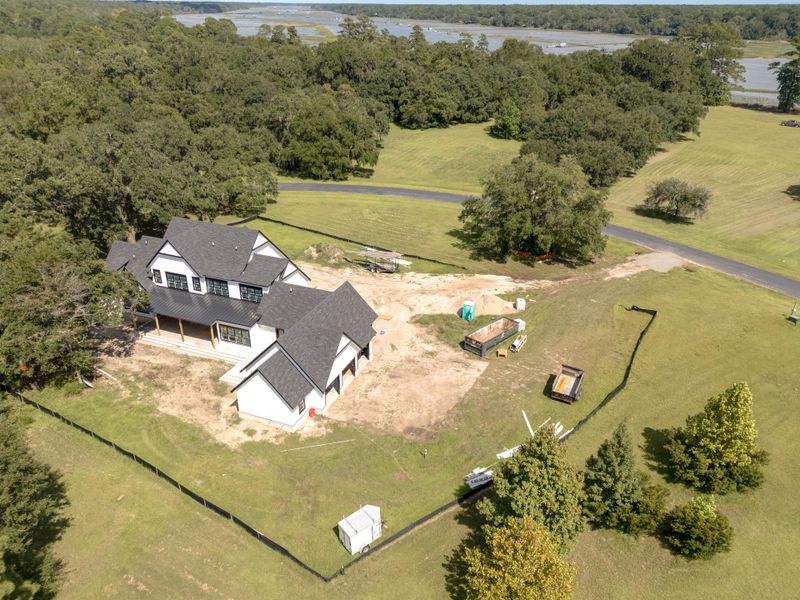 Front exterior of a new home in , Wadmalaw Island, SC, highlighting curb appeal (Image 15). Front exterior of a new home in , Wadmalaw Island, SC, highlighting curb appeal (Image 15).