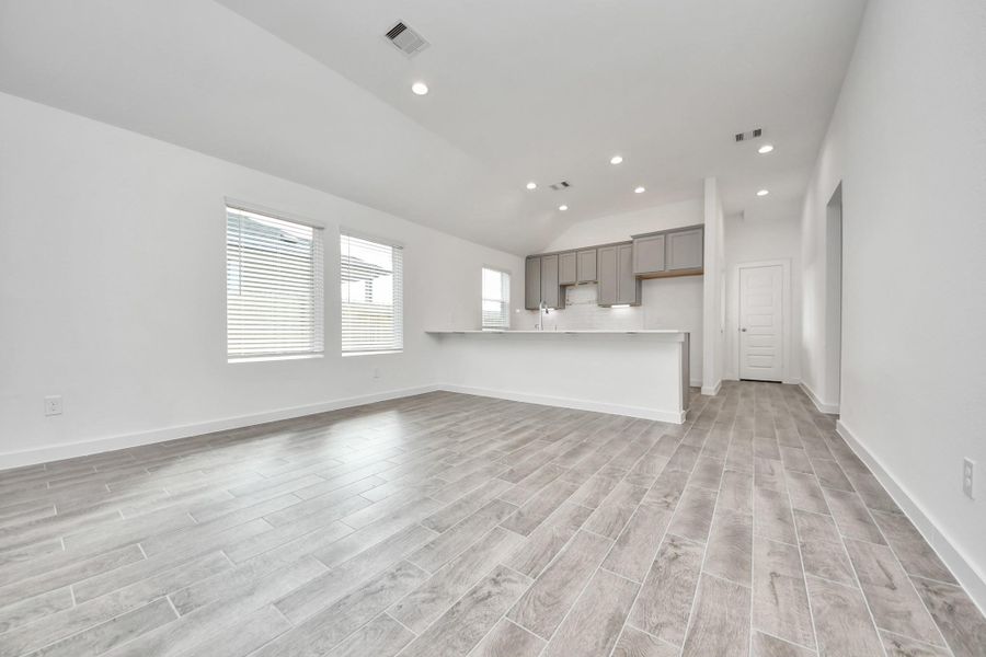 Make memories gathered around the table with your family and friends! This spacious dining room features elegant flooring, custom paint, and adjacent to family room and kitchen for open concept feel.