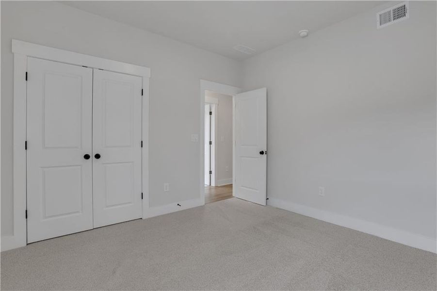Spacious, unfurnished interior of a new home in The Paddocks at Doc Hughes, Buford (Image 46).