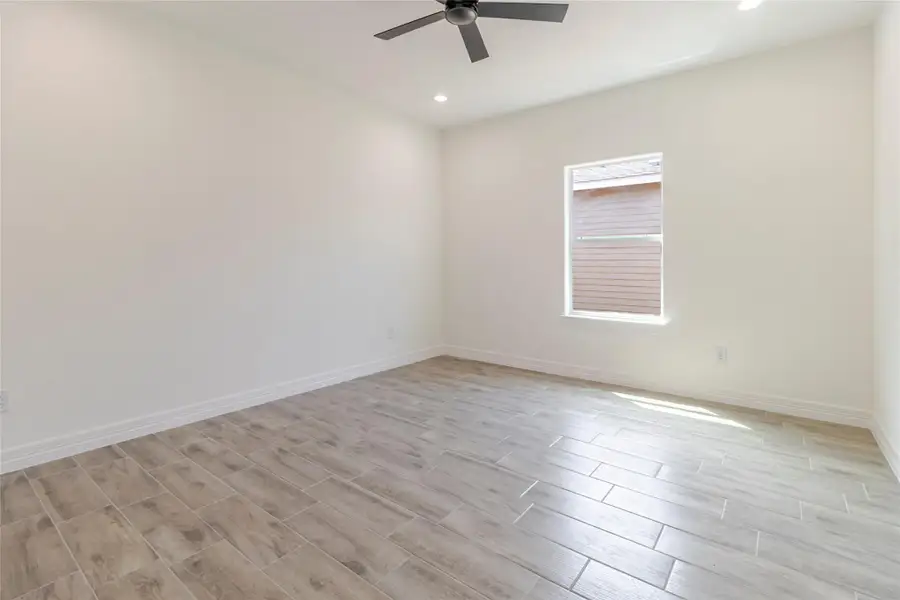 Bedroom three carries through the no-carpet flooring and leaves long, uninterrupted walls for furniture placement. Bedroom three carries through the no-carpet flooring and leaves long, uninterrupted walls for furniture placement.