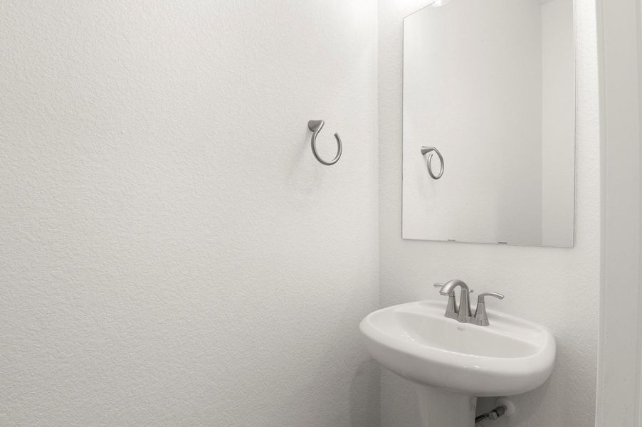 Bathroom featuring a textured wall