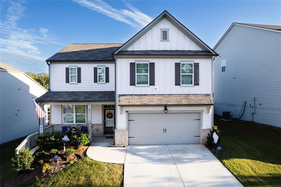 Front exterior of a new home in , Braselton, GA, highlighting curb appeal (Image 2).