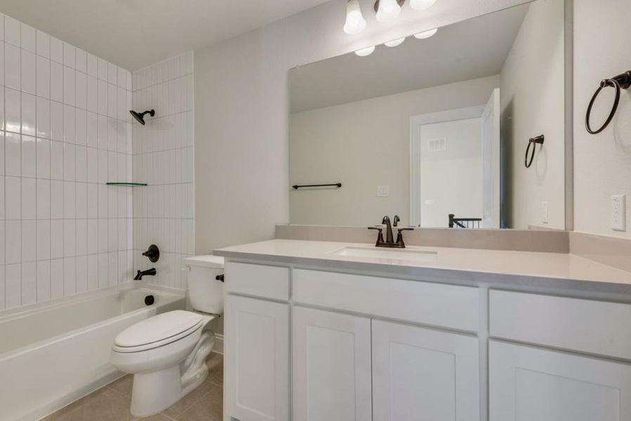 Representative furnished interior of a home built from the Brandonwood by Grand Homes in Edgewater, Fate (Image 11).