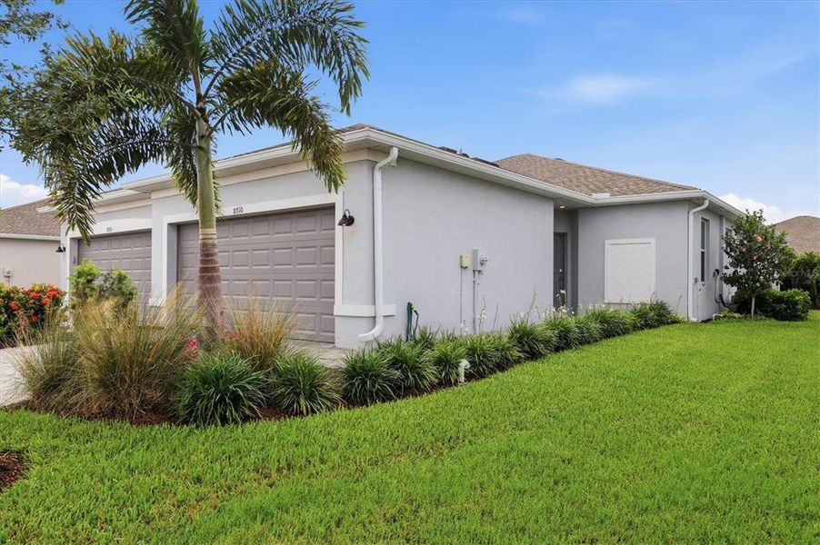 Front exterior of a new home in , Englewood, FL, highlighting curb appeal (Image 13).