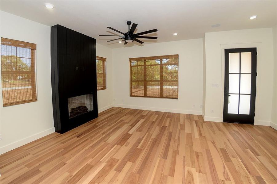 Modern fireplace with built in speakers in the living room.