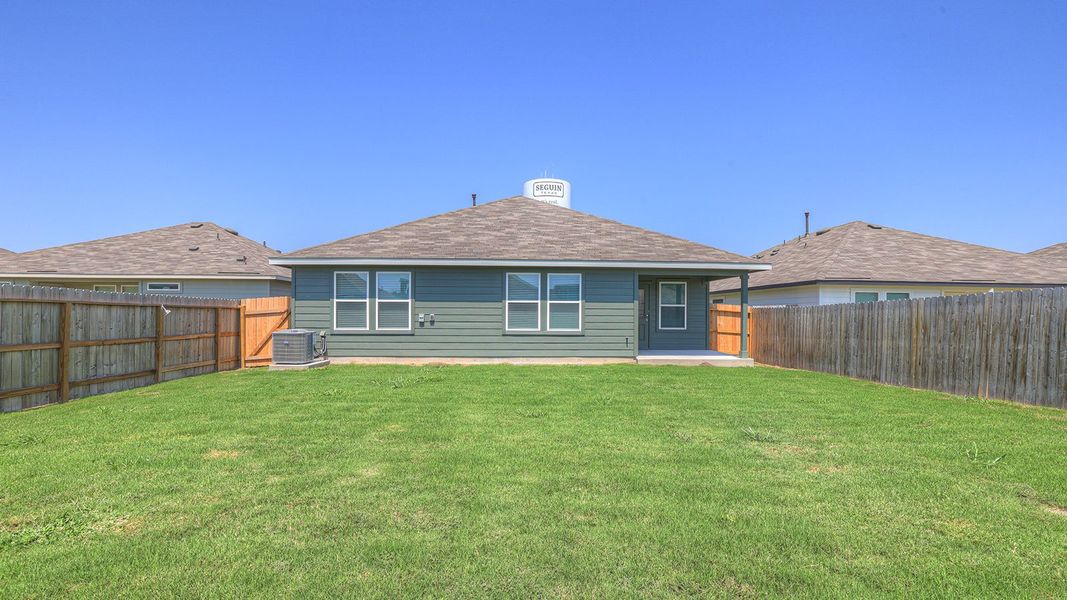 Front exterior of a new home in Navarro Fields, Seguin, TX, highlighting curb appeal (Image 20). Front exterior of a new home in Navarro Fields, Seguin, TX, highlighting curb appeal (Image 20).