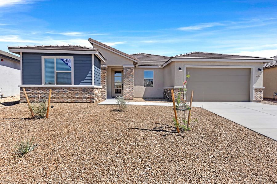 Front exterior of a new home in Montelena, Marana, AZ, highlighting curb appeal (Image 1). Front exterior of a new home in Montelena, Marana, AZ, highlighting curb appeal (Image 1).