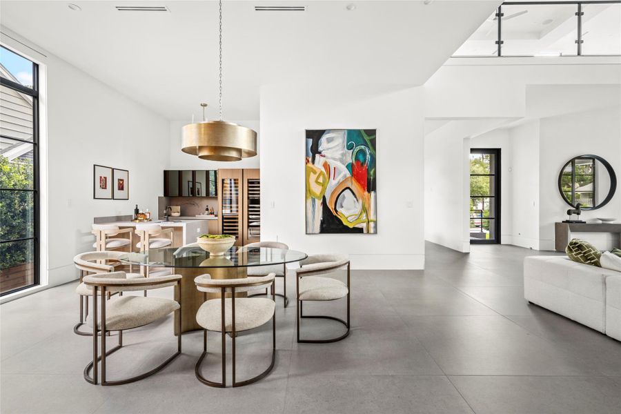[Breakfast Room] For quick meals, kitchen conversations, and watching the chef do all the work! Positioned next to large windows for abundant natural light.