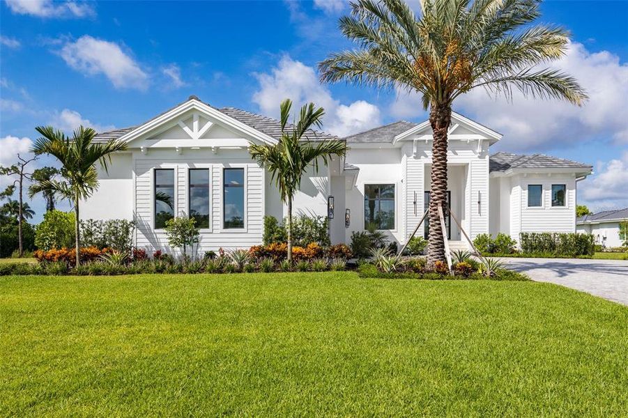 Front exterior of a new home in , Fort Myers, FL, highlighting curb appeal (Image 25). Front exterior of a new home in , Fort Myers, FL, highlighting curb appeal (Image 25).