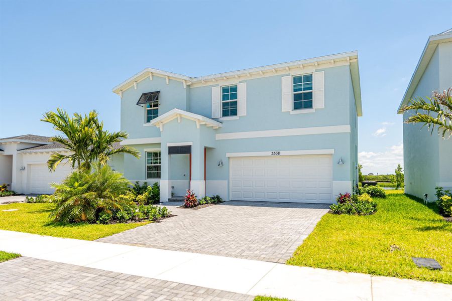 Front exterior of a new home in , Fort Pierce, FL, highlighting curb appeal (Image 14).