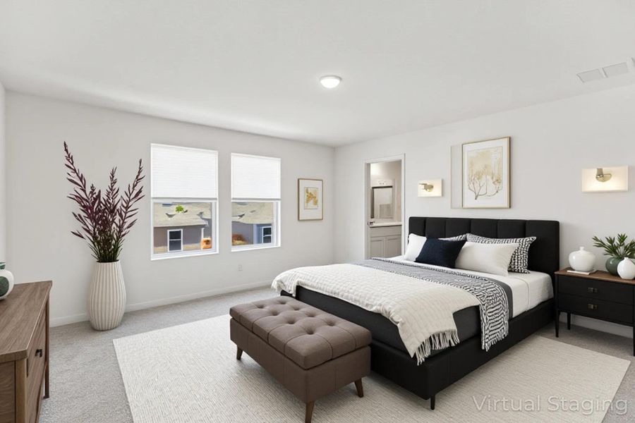 Bedroom featuring light carpet and baseboards
