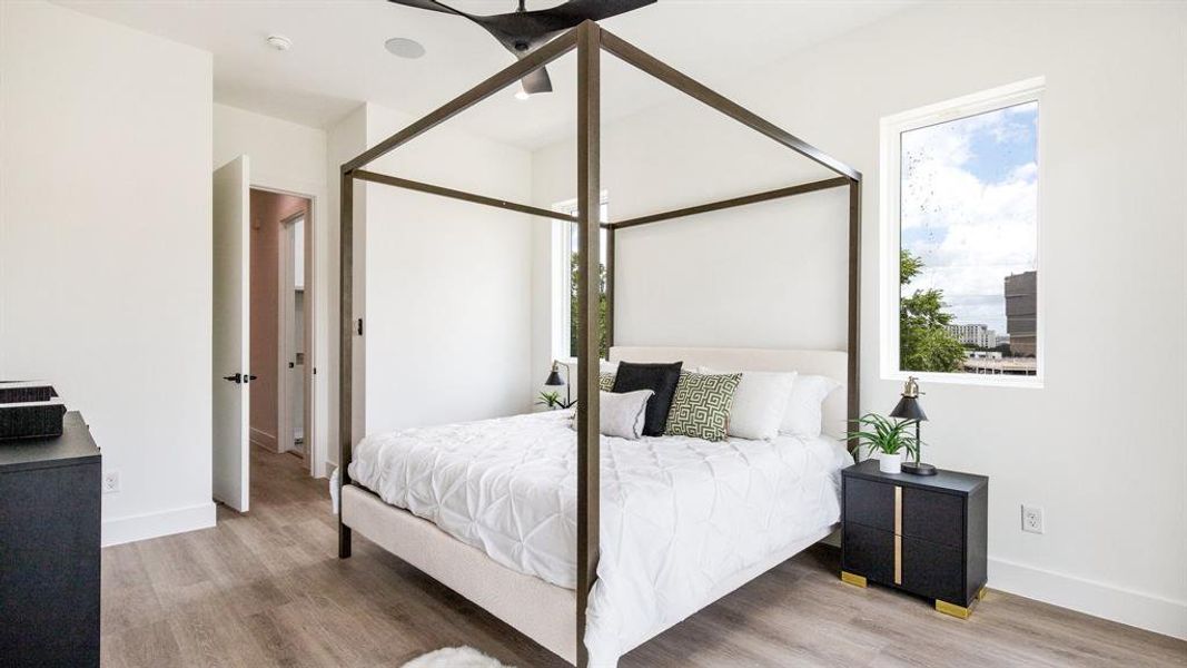 Bedroom with hardwood / wood-style floors