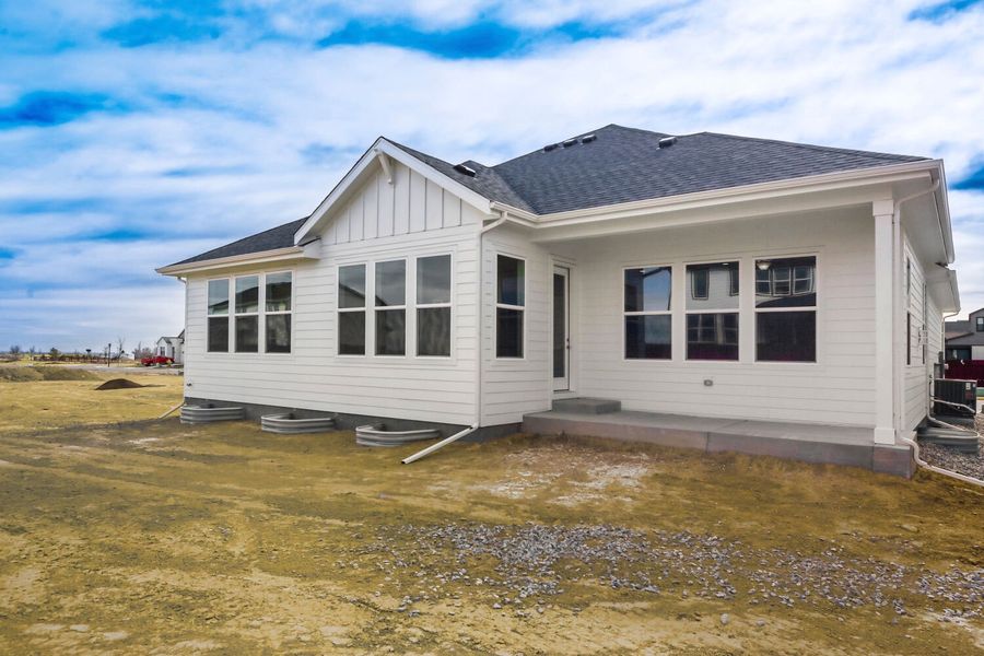 Exterior details and patio area of a home in RainDance, Windsor (Image 24).