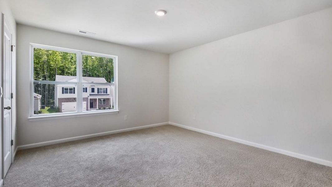 Spacious, unfurnished interior of a new home in The Estates at Edinborough, Gibsonville (Image 24).