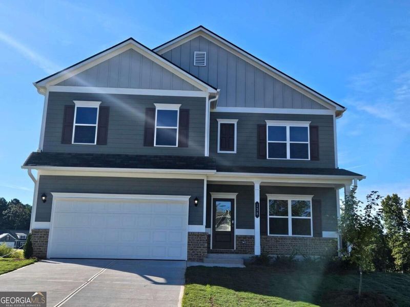 Front exterior of a new home in Maddox Station, Eatonton, GA, highlighting curb appeal (Image 2). Front exterior of a new home in Maddox Station, Eatonton, GA, highlighting curb appeal (Image 2).