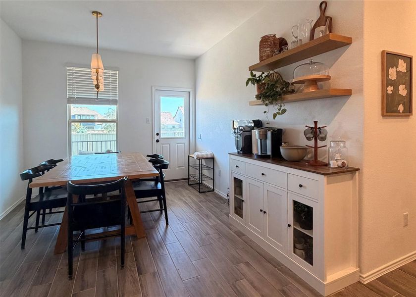 Dining room with wood tiled floors Dining room with wood tiled floors