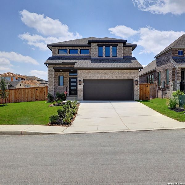 Front exterior of a new home in Ladera, San Antonio, TX, highlighting curb appeal (Image 2). Front exterior of a new home in Ladera, San Antonio, TX, highlighting curb appeal (Image 2).