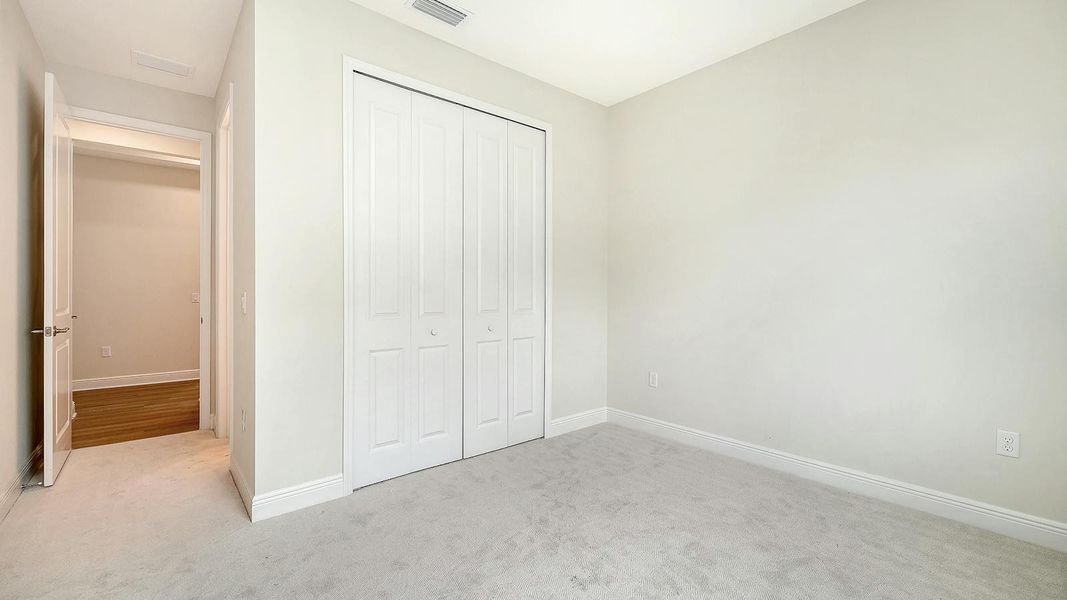 Spacious, unfurnished interior of a new home in Wildleaf Real Estate and Homes for Sale in Parrish, FL - Neal Communities, Parrish (Image 30).