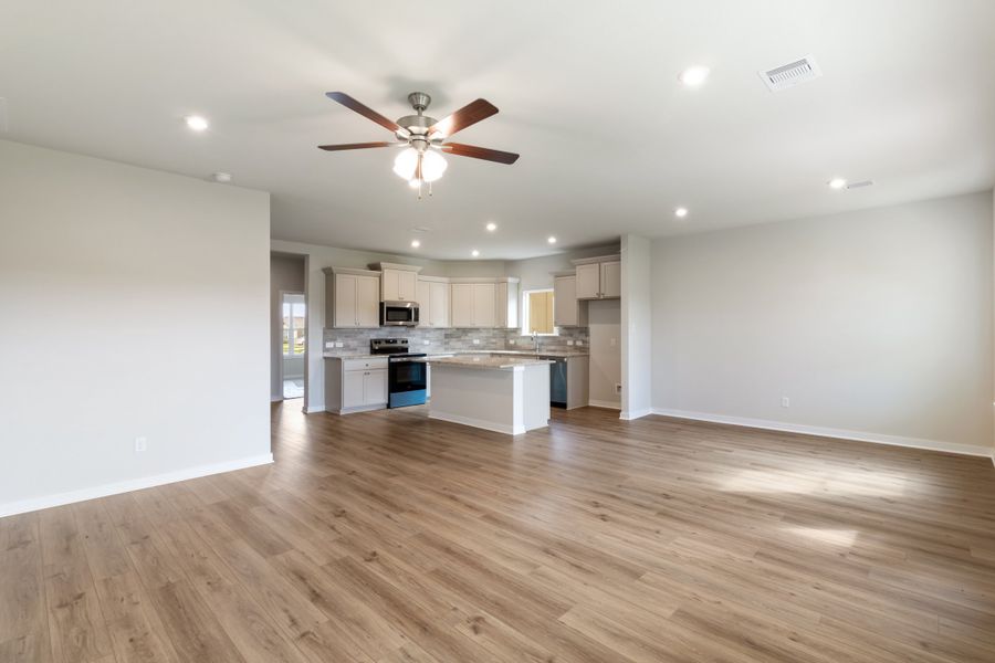 Representative unfurnished interior of a home built from the Guadalupe by Omega Builders in Hillside Village, Temple (Image 6).