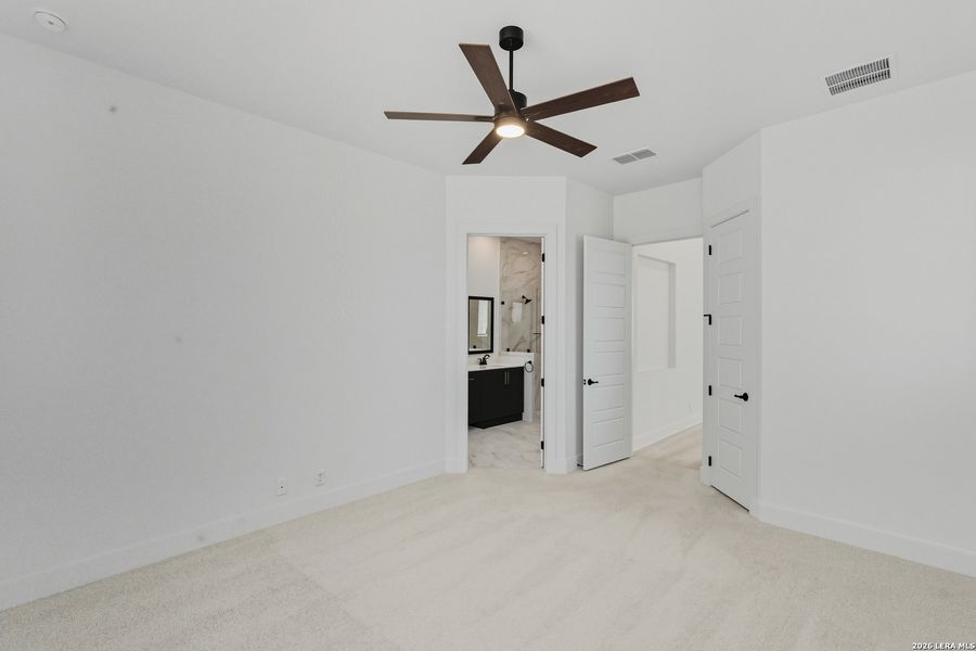 Spacious, unfurnished interior of a new home in Centero at Stone Oak, San Antonio (Image 21).