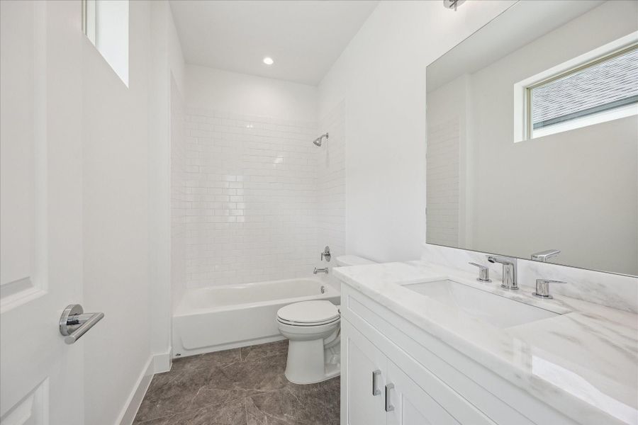 En-Suite Bathroom * Subway Tile * Porcelain Floors * Marble Counter.