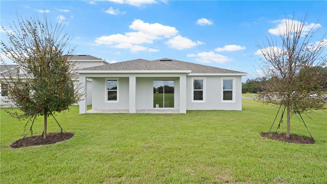 Front exterior of a new home in Trailside, Mount Dora, FL, highlighting curb appeal (Image 18).